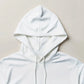White hoodie on a beige background